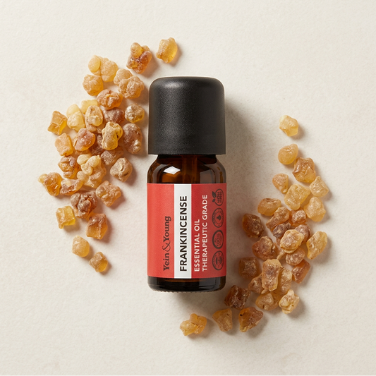 A 10ml bottle of Yein&Young Frankincense Essential Oil with a black cap and a label that includes the brand name and the product name.