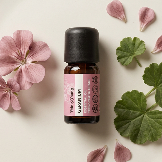 A 10ml bottle of Yein&Young Geranium Essential Oil with a pink label, therapeutic grade indication, and a black cap.