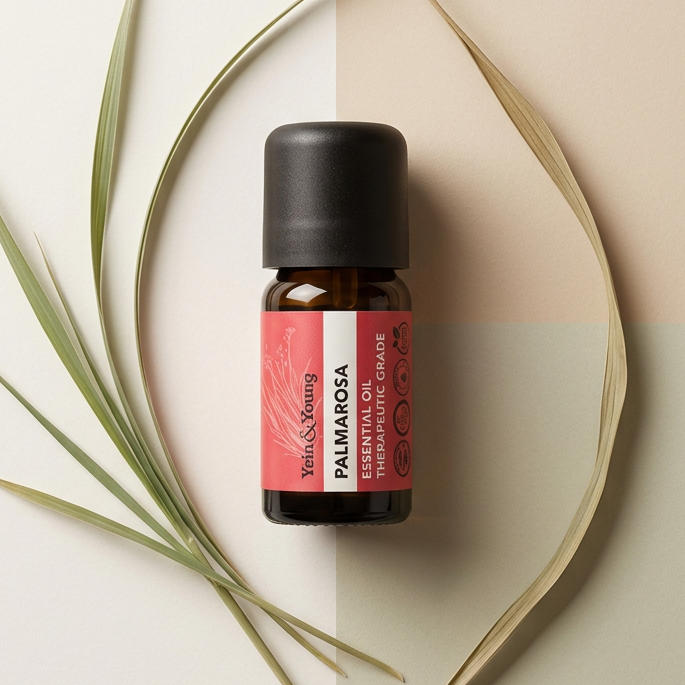 A bottle of Yein&Young Palmarosa Essential Oil with a black cap and a label that includes the product name and a brief description.